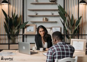 Types of Business Loans in Botswana : Business owners discussing loan details in a Botswana bank office