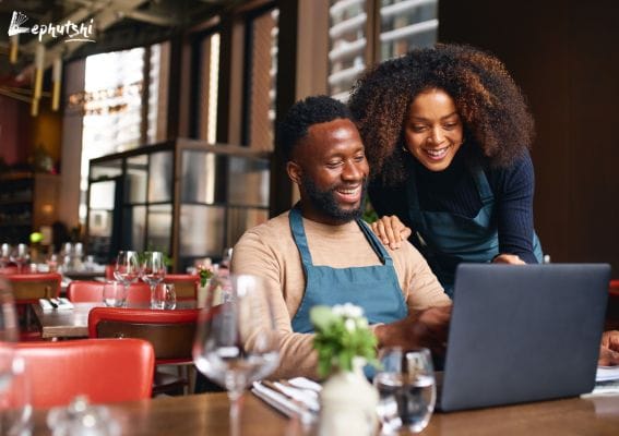 Free Advertising in Botswana | Grow Customers with Lephutshi 1 Free Advertising in Botswana - Botswana shop owner adding their business details on Lephutshi using a laptop